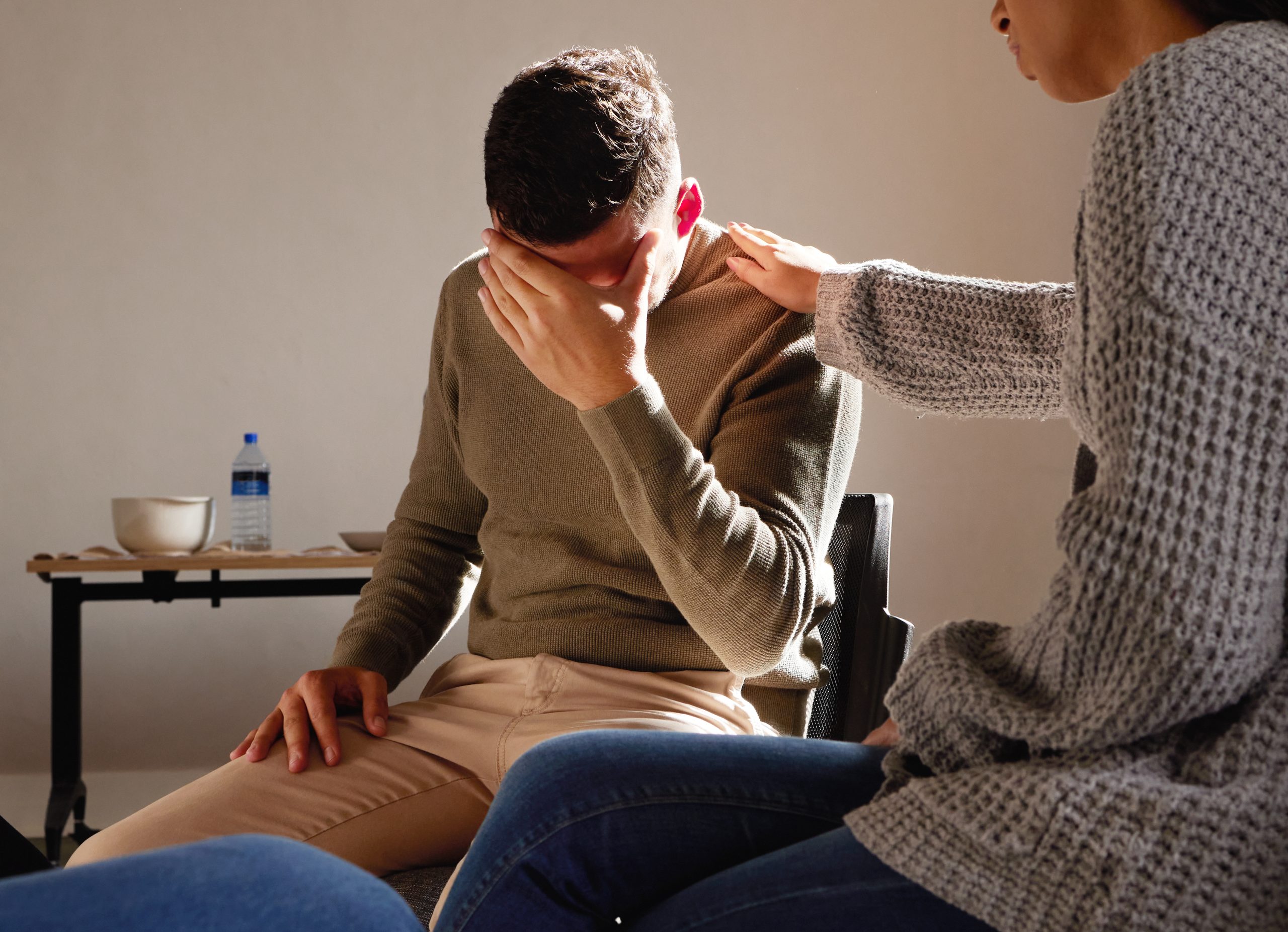 Therapy, support and crying man with empathy, psychology help and mental health problem, depression.